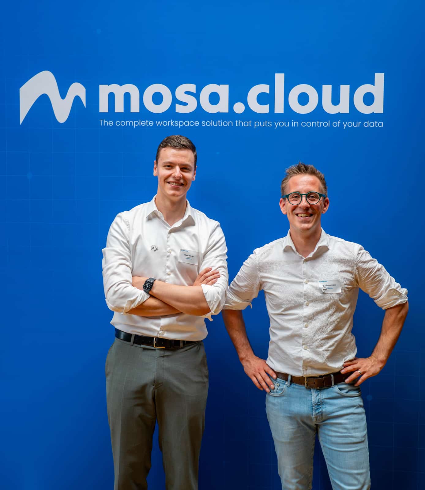 Founders Niels Kersic and Riël Notermans in front of the mosa.cloud wall